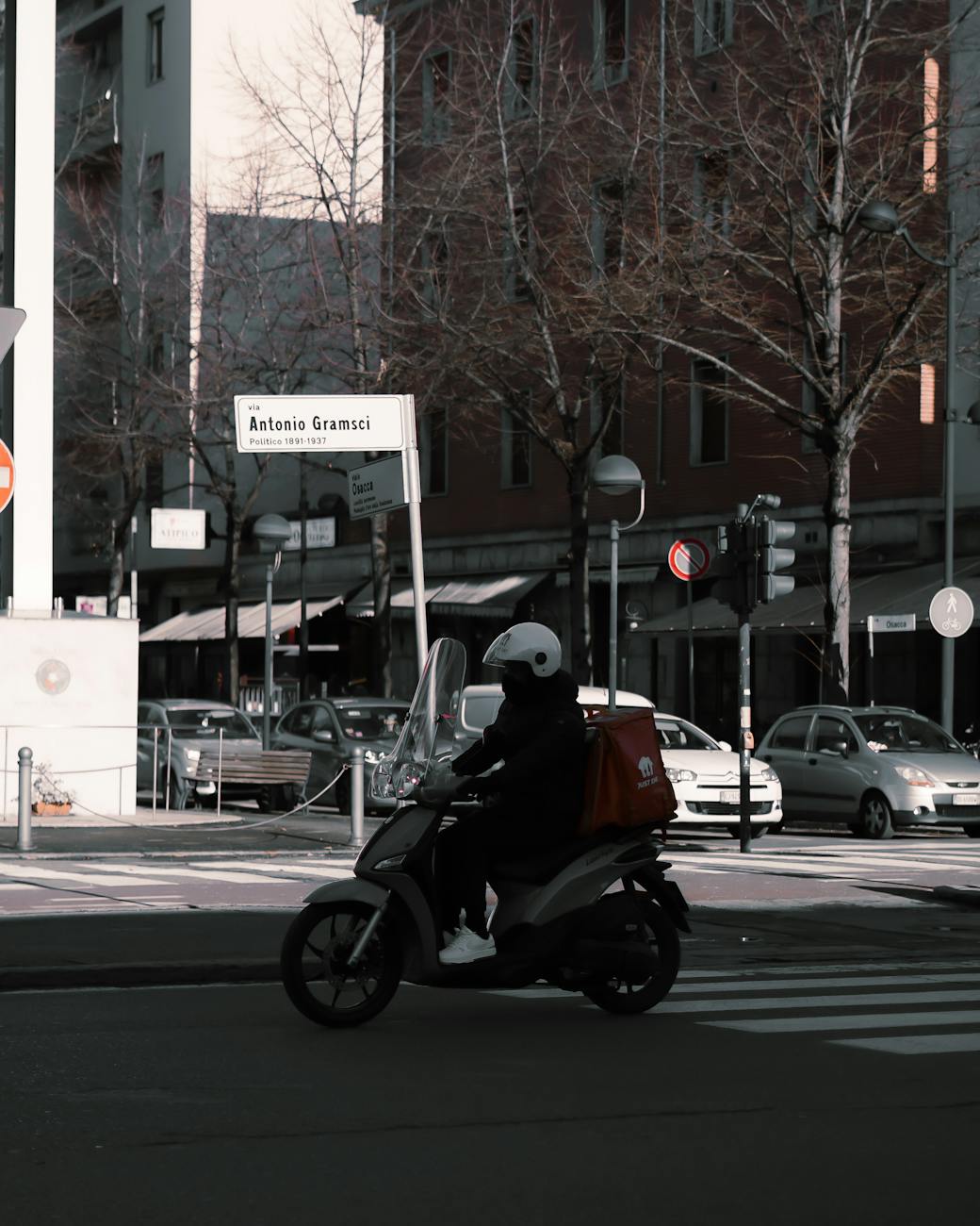 food delivery driver on street in city in italy