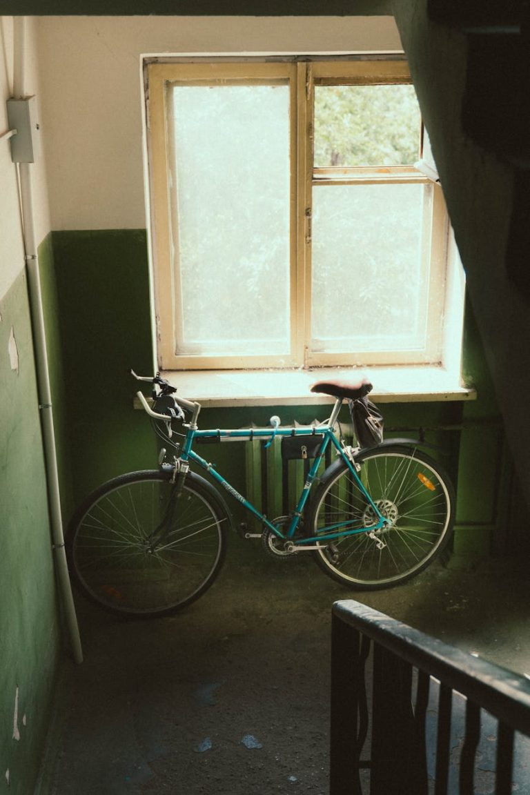 there s an old bicycle by the window in the entryway