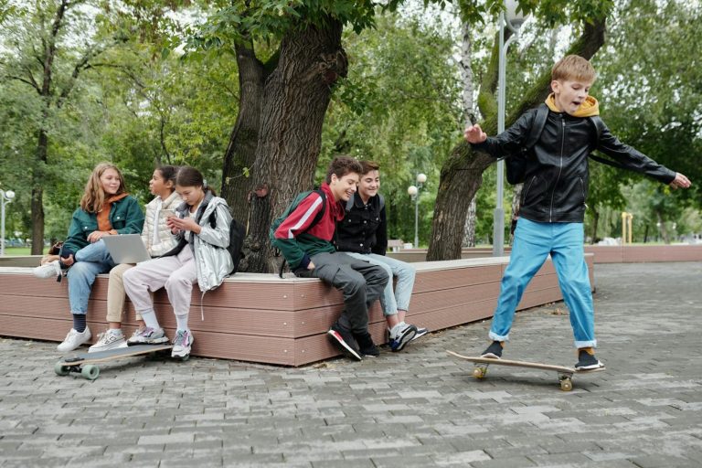 a young boy riding a skateboard